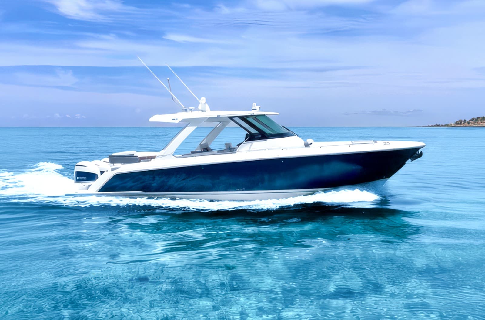 Boat with a navy hull cruising on clear blue water